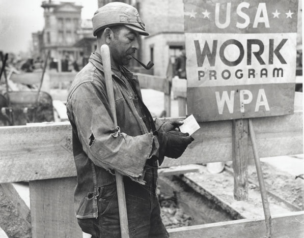 A WPA worker receives a paycheck, January 1939