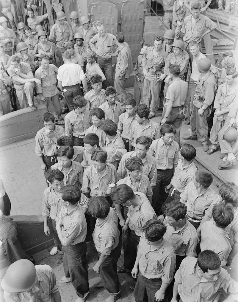 Captured Japanese and Korean prisoners aboard a U.S. Coast Guard vessel at Makin Island, ca. 1943.