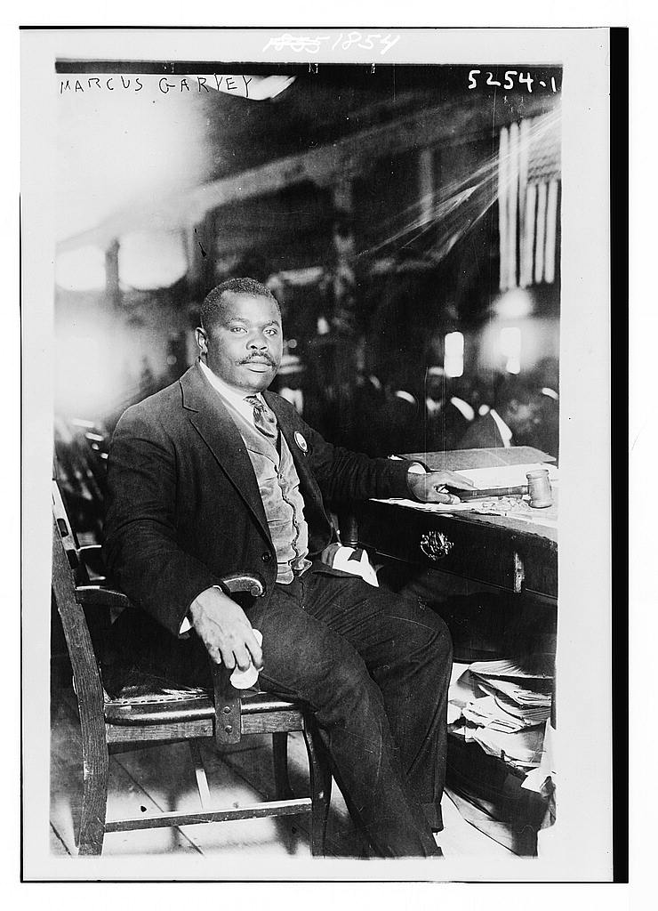 Marcus Garvey Full lgth., seated at desk, facing right.