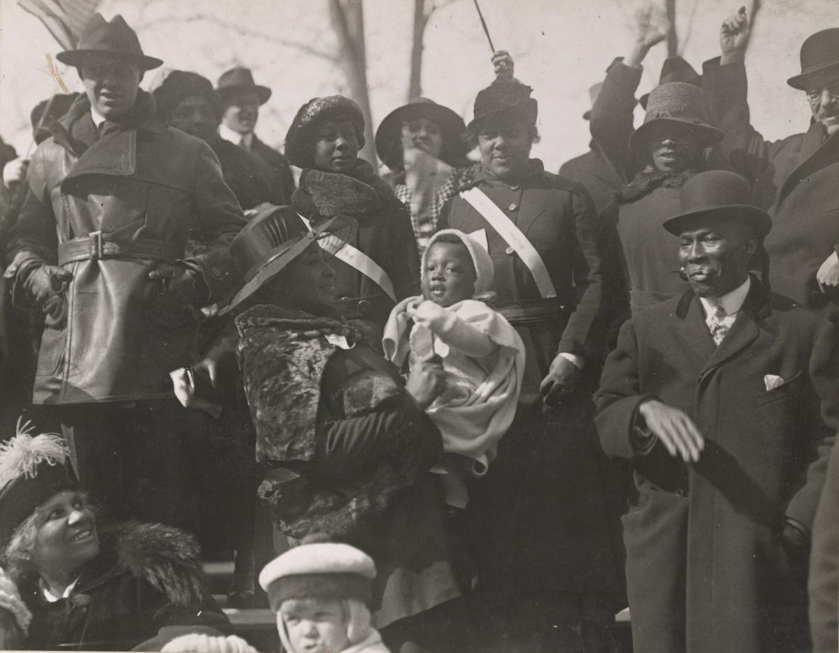 onlookers dressed in winter clothes at a parade