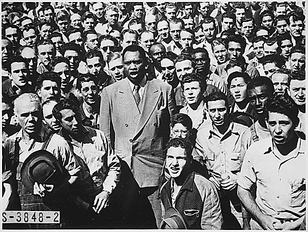 Robeson standing in a crowd, singing with the people