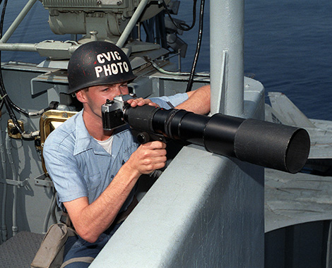 soldier looking through telescope