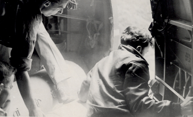 OSS Dispatchers Preparing to Drop Food, Clothing, and Medical Supplies to Downed Allied Airmen in Roumania (ARC 6851110)