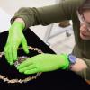 Senior conservator Lauren Varga prepares a rare jewel necklace