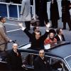 President Richard Nixon and First Lady Pat Nixon wave from the Presidential limousine in the inaugural motorcade