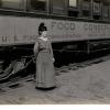Woman Standing in front of the Pennsylvania Food Conservation Train
