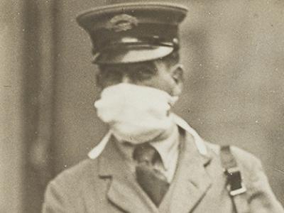 Letter carrier wears mask during 1918 flu pandemic