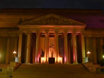 National Archives Building in gold and purple lights