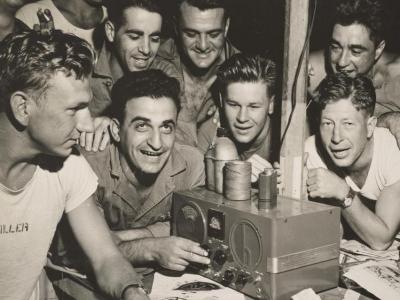 US Marines listen to news of V-J Day on the radio