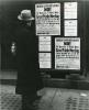 Man looks at signs calling for American boycott of 1936 Olmpics