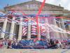 red, white, and blue confetti and streamers float in front of the National Archives Building on July 3, 2019