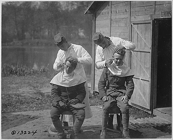 Cutting hair at the camp