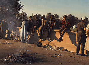 Washington, D.C. Anti-Vietnam Demonstration. Protesters sit on the wall around their bonfire