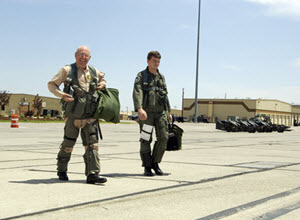 US Air Force (USAF) Lieutenant Colonel (LTC) Joseph Crecca Jr. walks out with his front seater for an incentive ride